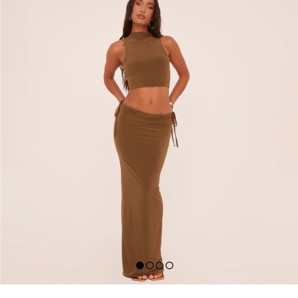 HIGH NECK OPEN BACK CROP TOP IN OLIVE GREEN SLINKY AND SKIRT.